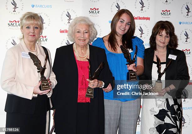 Hilary Hentriques , Dame Vera Lynn, Emily Cummins and Jane Walker pose with their awards as they attend the Women of the Year Lunch at...