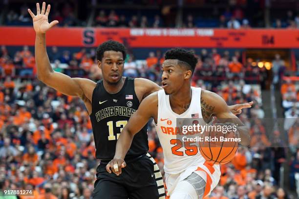 Tyus Battle of the Syracuse Orange drives to the basket as Bryant Crawford of the Wake Forest Demon Deacons defends during the second half at the...