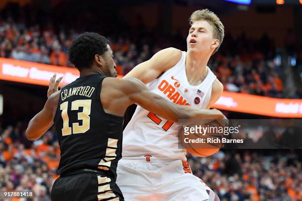 Bryant Crawford of the Wake Forest Demon Deacons reaches for the ball controlled by Marek Dolezaj of the Syracuse Orange during the second half at...