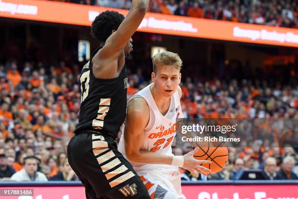 Marek Dolezaj of the Syracuse Orange drives to the basket against the defense of Bryant Crawford of the Wake Forest Demon Deacons during the second...