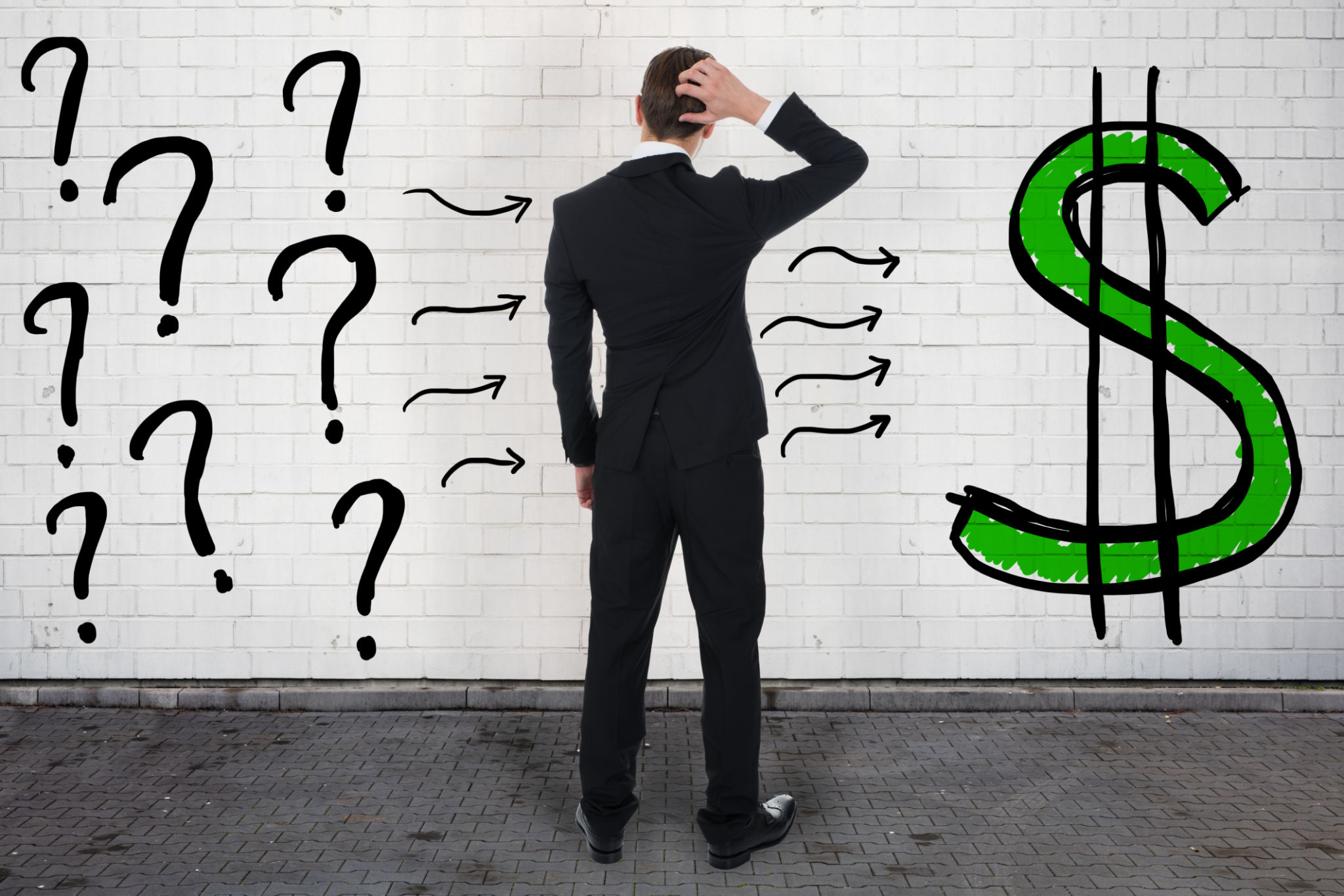 Confused Businessman Looking At Question Marks And Dollar Sign Confused Businessman Looking At Question Marks And Dollar Sign
