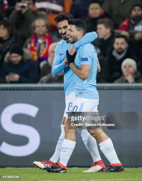 Ilkay Gundogan of Manchester City celebrates his team's first goal with his team mateSergio Aguero during the UEFA Champions League Round of 16 First...