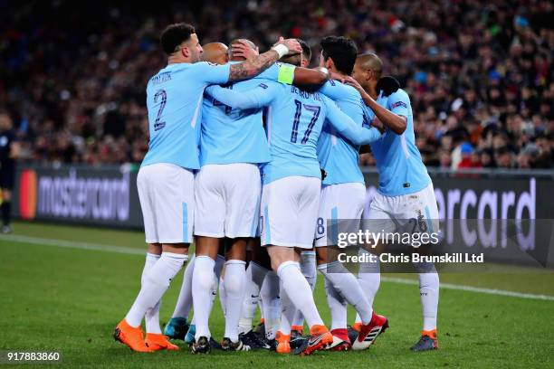 The Manchester City team celebrate after Ilkay Gundogan scored the opening goal during the UEFA Champions League Round of 16 First Leg match between...