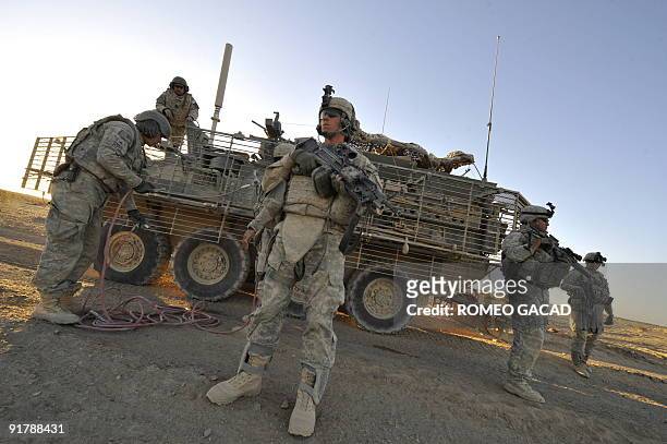 To go with Afghanistan-unrest-US-military-weapons,SCENE by Daphne BENOIT US Army personnel of the 3rd Platoon, Charlie Company, 1st Infantry...