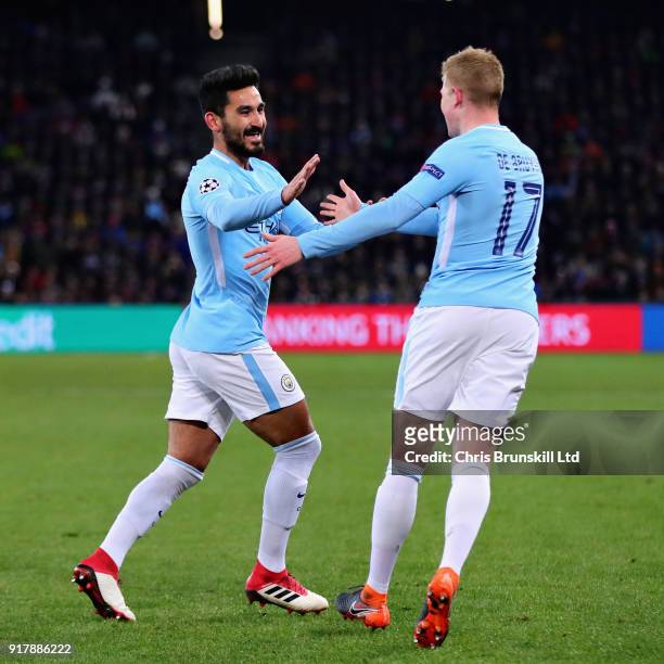 Ilkay Gundogan of Manchester City celebrates with teammate Kevin De Bruyne after scoring the opening goal during the UEFA Champions League Round of...