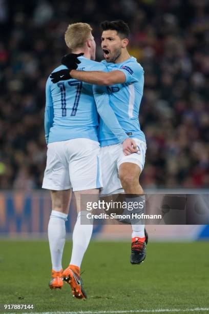 Sergio Aguero of Manchester City celebrates his team's third goal with team mate Kevin De Bruyne during the UEFA Champions League Round of 16 First...