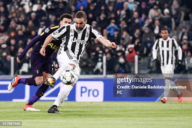 Gonzalo Higuain of Juventus scores his first goal during the UEFA Champions League Round of 16 First Leg match between Juventus and Tottenham Hotspur...