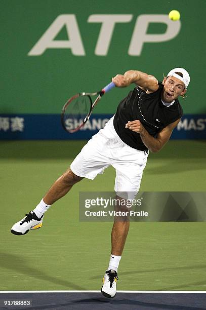 Lukasz Kubot of Poland serves against Stanistas Wawrinka of Switzerland during day two of 2009 Shanghai ATP Masters 1000 at the Qi Zhong Tennis...