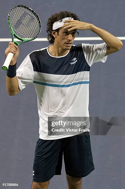 Martin Vassallo-Arguello of Argentina argues with the umpire during his match against Rainer Schuettler of Germany on day two of 2009 Shanghai ATP...