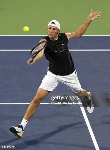 Lukasz Kubot of Poland returns a shot to Stanistas Wawrinka of Switzerland during day two of 2009 Shanghai ATP Masters 1000 at the Qi Zhong Tennis...