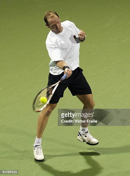 Rainer Schuettler of Germany returns a shot to Martin Vassallo-Arguello of Argentina during day two of 2009 Shanghai ATP Masters 1000 at the Qi Zhong...