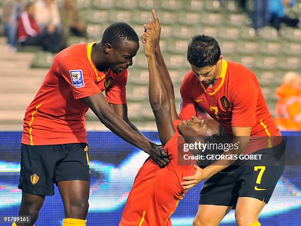 Belgian's Emile Mpenza , Roland Lamah , and Kevin Mirallas celebrate after scoring during their World Cup 2010 qualifying football match against...