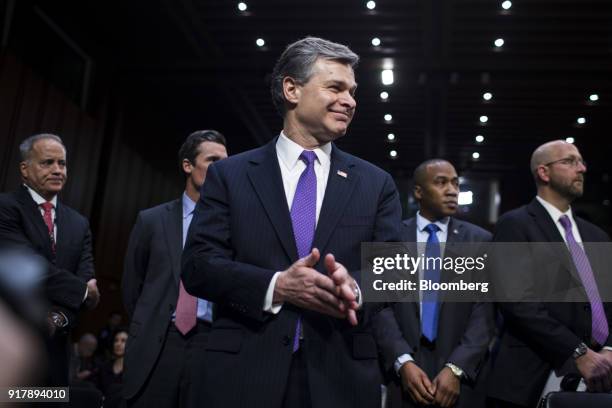 Christopher Wray, director of the Federal Bureau of Investigation , smiles before testifying during a Senate Intelligence Committee hearing on...