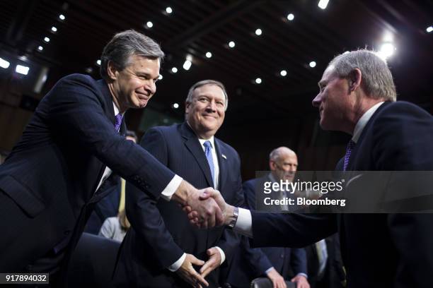 Christopher Wray, director of the Federal Bureau of Investigation , left, shakes hands with chairman Senator Richard Burr, a Republican from North...