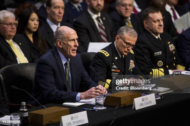 Dan Coats, director of national intelligence, left , testifies during a Senate Intelligence Committee hearing on worldwide threats in Washington,...