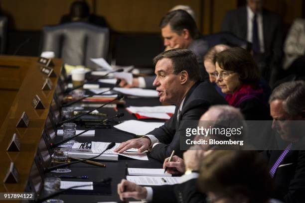 Senator Mark Warner, a Democrat from Virginia and ranking member of the Senate Intelligence Committee, center, speaks during a hearing on worldwide...