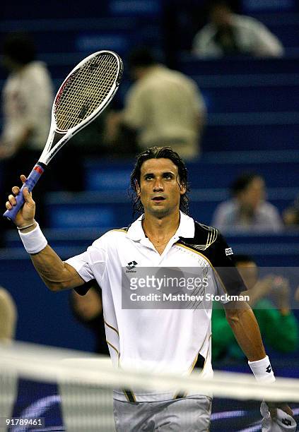 David Ferrer of Spain acknowledges the crowd after defeating Richard Gasquet of France during day two of the 2009 Shanghai ATP Masters 1000 at Qi...
