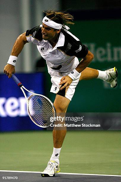 David Ferrer of Spain serves to Richard Gasquet of France during day two of the 2009 Shanghai ATP Masters 1000 at Qi Zhong Tennis Centre on October...