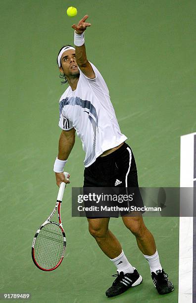 Fernando Gonzalez of Chile serves to Mischa Zverev of Germany during day two of the 2009 Shanghai ATP Masters 1000 at Qi Zhong Tennis Centre on...