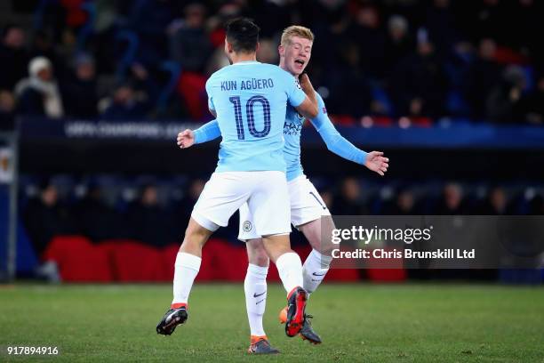 Sergio Aguero of Manchester City celebrates with teammate Kevin De Bruyne after scoring his teams third goal during the UEFA Champions League Round...