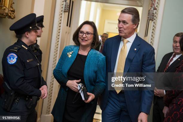 Sens. Deb Fischer, R-Neb., and David Perdue, R-Ga., leave the Republican Senate Policy luncheon in the Capitol on February 13, 2018.