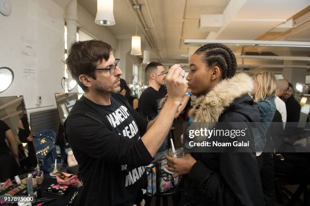 Model prepares backstage at the Gabriela Hearst fashion show during New York Fashion Wee on February 13, 2018 in New York City.