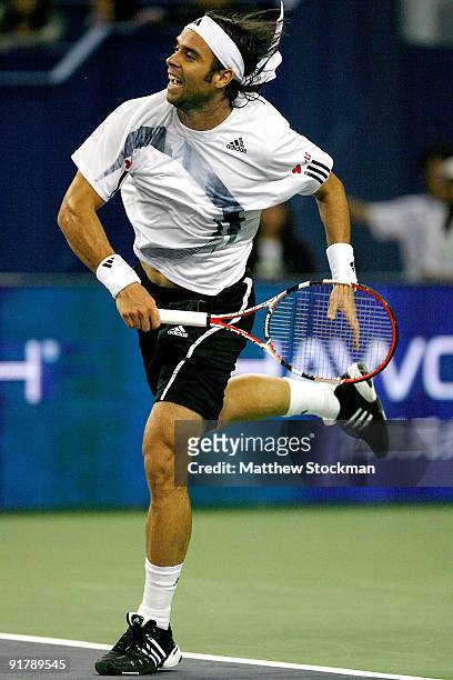 Fernando Gonzalez of Chile serves to Mischa Zverev of Germany during day two of the 2009 Shanghai ATP Masters 1000 at Qi Zhong Tennis Centre on...