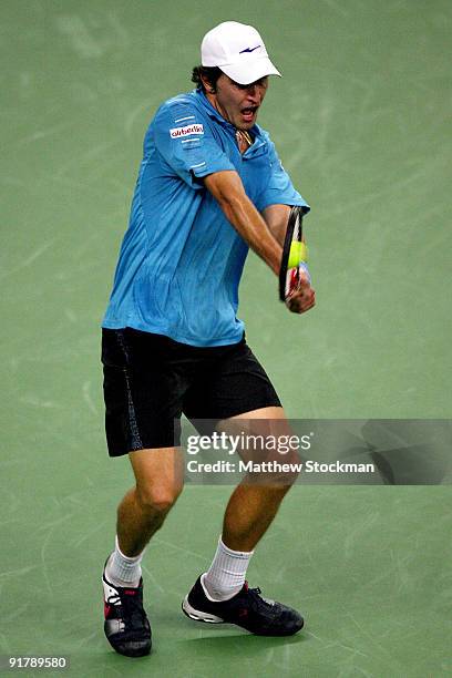 Mischa Zverev of Germany returns a shot to Fernando Gonzalez of Chile during day two of the 2009 Shanghai ATP Masters 1000 at Qi Zhong Tennis Centre...