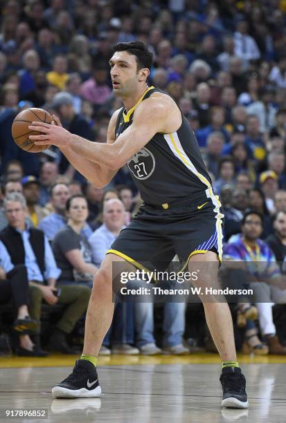 Zaza Pachulia of the Golden State Warriors looks to pass the ball against the San Antonio Spurs during an NBA basketball game at ORACLE Arena on...