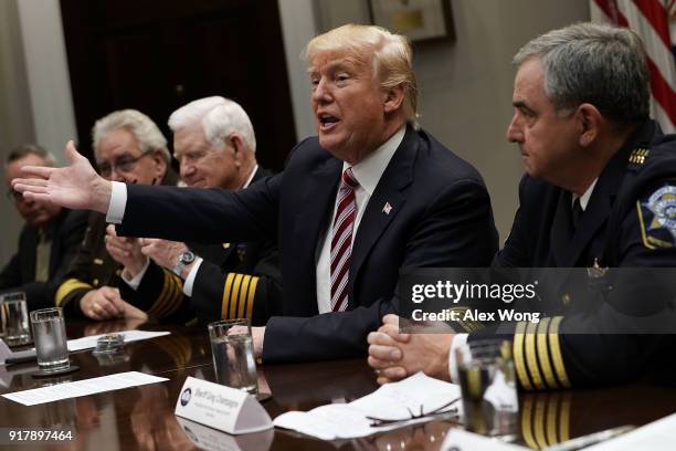 President Donald Trump speaks during a meeting with the National Sheriffs Association in the Roosevelt Room of the White House February 13, 2018 in...