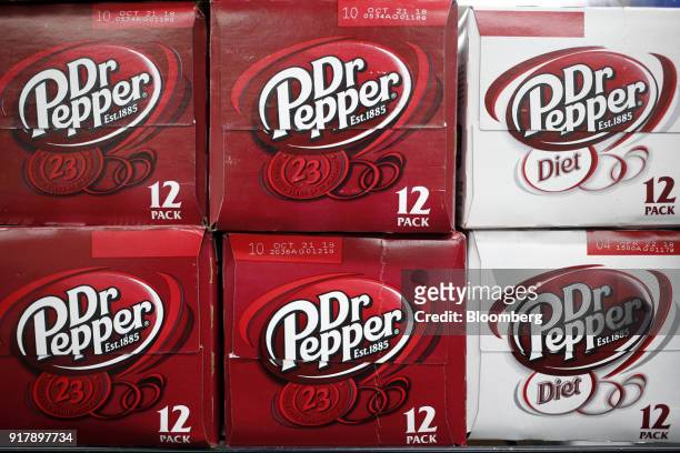 Cases of Dr. Pepper brand soda sit on display for sale at a convenience store in Bagdad, Kentucky, U.S., on Sunday, Feb. 11, 2018. Dr. Pepper Snapple...