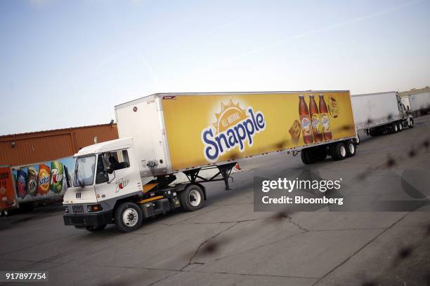 Snapple brand beverages signage is seen on a delivery truck leaving a facility in Louisville, Kentucky, U.S., on Tuesday, Feb. 13, 2018. Dr. Pepper...