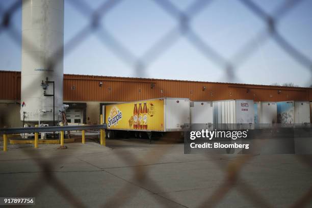 Snapple brand beverages signage is seen on a delivery truck outside a facility in Louisville, Kentucky, U.S., on Tuesday, Feb. 13, 2018. Dr. Pepper...