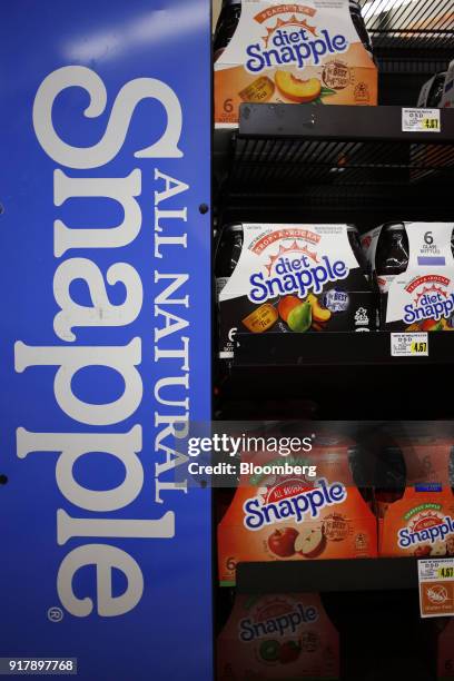 Cases of Snapple brand beverages are displayed for sale at a grocery store in Louisville, Kentucky, U.S., on Tuesday, Feb. 13, 2018. Dr. Pepper...