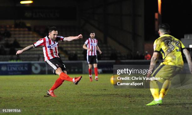 Lincoln City's Neal Eardley scores the opening goal during the Sky Bet League Two match between Lincoln City and Cheltenham Town at Sincil Bank...