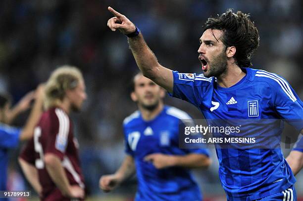 Greece's Georgios Samaras celebrates after scoring against Latvia during their 2010 World Cup qualification football game at the Athens Olympic...
