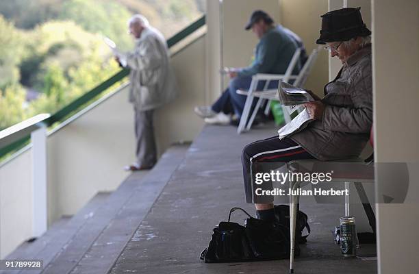 Racegoers study the form at Salisbury Racecourse on October 12, 2009 in Salisbury, England.