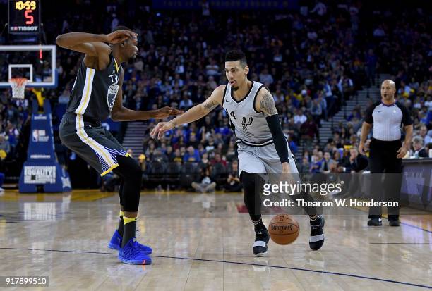 Danny Green of the San Antonio Spurs dribbles the ball while guarded by Kevin Durant of the Golden State Warriors during an NBA basketball game at...