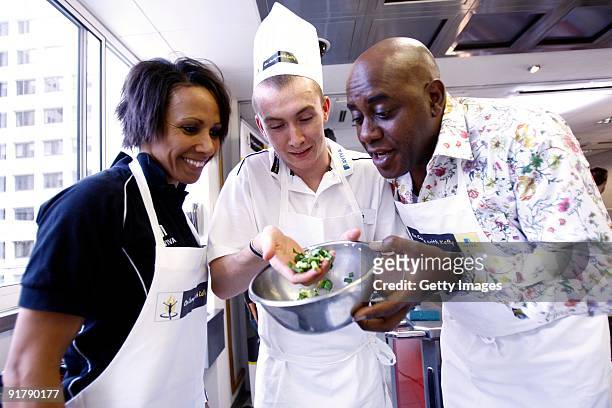 Young athlete Ben Lindsay in the kitchen with Dame Kelly Holmes and Ainsley Harriott during the Aviva On Camp with Kelly Cookery Get-Together on...