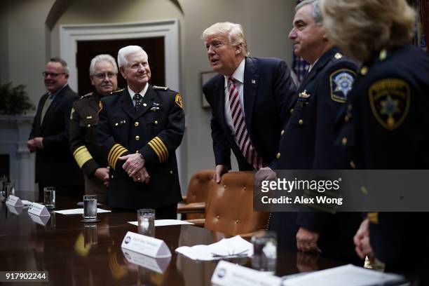 President Donald Trump greets President of the National Sheriffs Association Harold Eavenson and other representatives of the National SheriffsÕ...