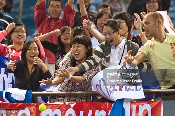 Suporters of Marat Safin try to catch up a ball after Safin's match against Mao-Xin Gong of China during day two of 2009 Shanghai ATP Masters 1000 at...