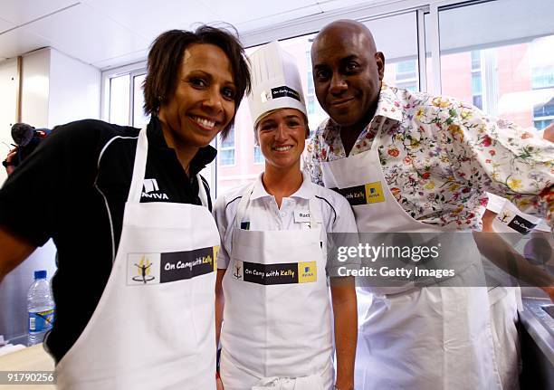 Young athlete Rachel Stringer in the kitchen with Dame Kelly Holmes and Ainsley Harriott during the Aviva On Camp with Kelly Cookery Get-Together on...