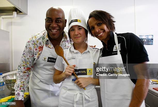Young athlete Klachen Cheshire in the kitchen with Dame Kelly Holmes and Ainsley Harriott during the Aviva On Camp with Kelly Cookery Get-Together on...