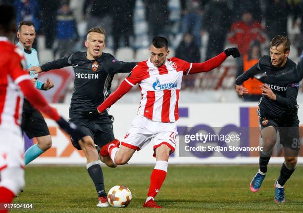 Nemanja Radonjic of Crvena Zvezda in action against Pontus Wernbloom and Konstantin Kuchaev of CSKA Moscow during UEFA Europa League Round of 32...