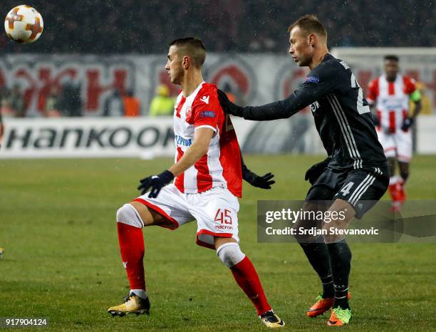 Aleksandar Pesic of Crvena Zvezda in action against Vasili Berezutski of CSKA Moscow during UEFA Europa League Round of 32 match between Crvena...