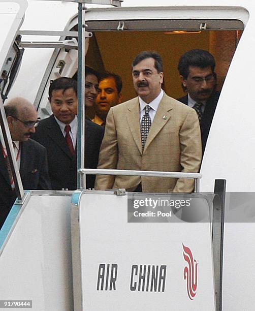 Pakistani Prime Minister Yousuf Raza Gilani arrrives at Beijing airport on October 12, 2009 in Beijing, China. Gilani will spend four days on his...