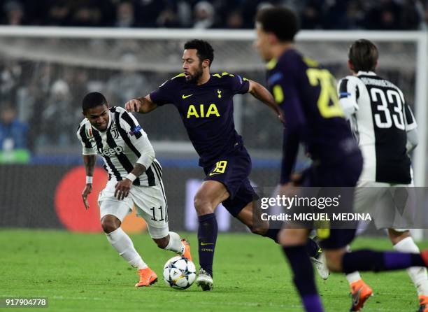 Tottenham Hotspur's Belgian midfielder Mousa Dembele runs with the ball during the UEFA Champions League round of sixteen first leg football match...