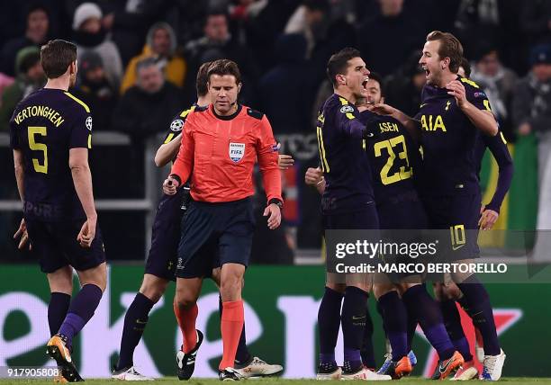 Tottenham Hotspur's Danish midfielder Christian Eriksen celebrates with teammates after scoring his team's second goal during the UEFA Champions...