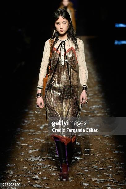 Model walks the runway for Coach 1941 during New York Fashion Week at Basketball City on February 13, 2018 in New York City.