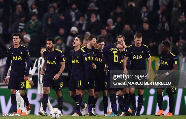 Tottenham Hotspur's Danish midfielder Christian Eriksen celebrates with teammates after scoring his team's second goal during the UEFA Champions...